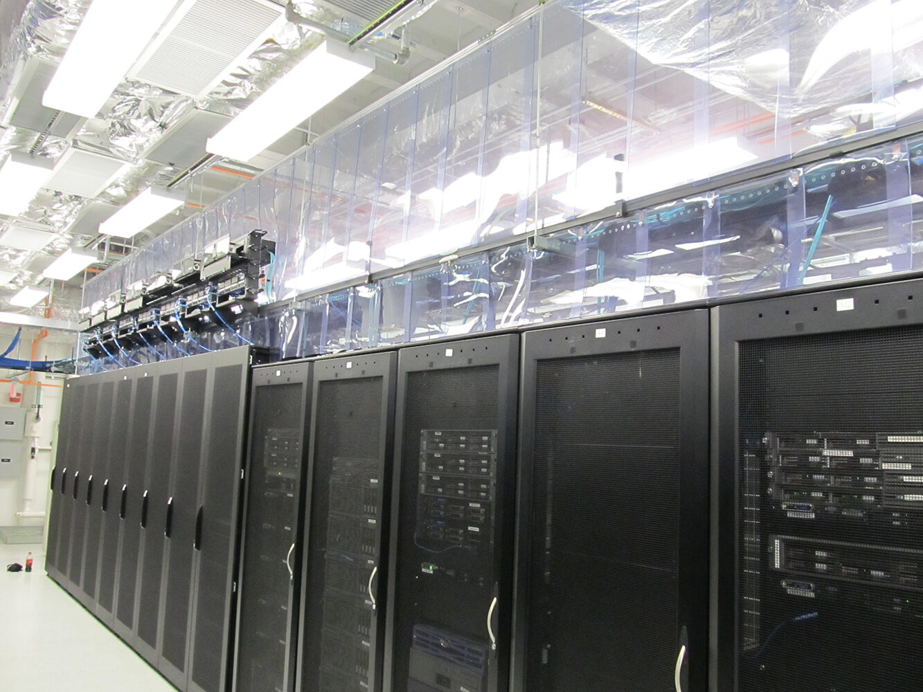 Data center aisle with server racks