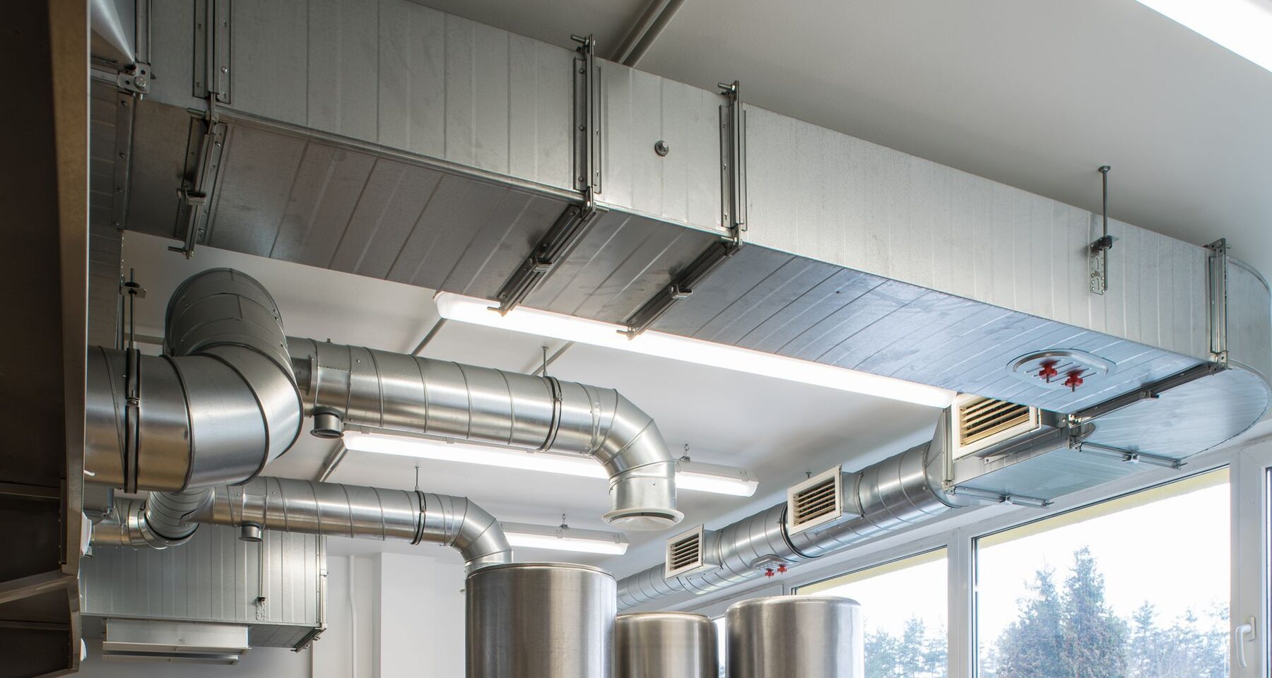 Ductwork and terminal units above a suspended ceiling in a commercial building